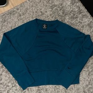 Nike sweater dark turquoise subtle Nike logo across the middle